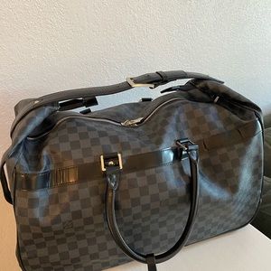 Louis Vuitton carry on luggage.
